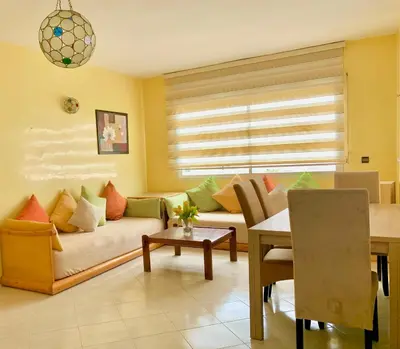 a living room with a couch and a table at Paradis Avec Piscine et Vue sur mer Harhoura in Temara