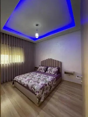 a bedroom with a bed with a blue ceiling at Ocean Park Zenata City Eco in Casablanca