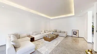 a living room with a white couch and a table at Villa S- Luxurious 8 masterbedrooms villa on 3000m2, close to all amenities, Golf and heart of Souissi in Rabat