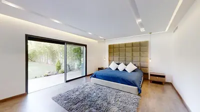 a bedroom with a bed and a large window at Villa S- Luxurious 8 masterbedrooms villa on 3000m2, close to all amenities, Golf and heart of Souissi in Rabat