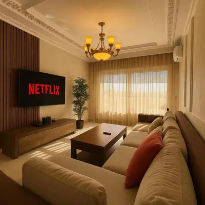 a living room with a couch and a tv at Cosy ensoleillé 3 CH - central et proche du train et tramway in Casablanca