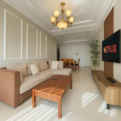 a living room with a couch and a table at Cosy ensoleillé 3 CH - central et proche du train et tramway in Casablanca