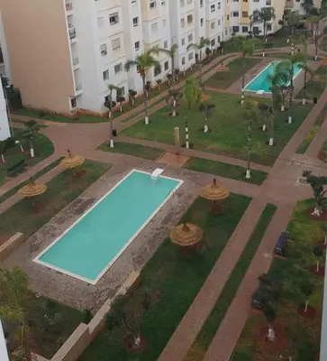 an overhead view of a swimming pool in a resort at Sweet home in Dar Bouazza