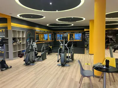 a gym with treadmills and elliptical machines at Moroccan Beach Delight in Dar Bouazza