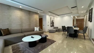 a living room with a couch and a table at Garden View and Terrace 3BR - AppartAli Luxury Platform in Casablanca