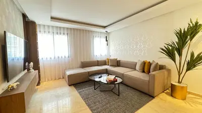 a living room with a couch and a table at Street view 2BR Terrace - AppartAli Luxury Platform in Casablanca