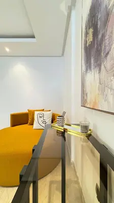 a bedroom with a bed and a glass table at Street view 2BR Terrace - AppartAli Luxury Platform in Casablanca