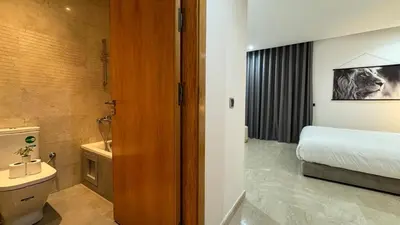 a bathroom with a bed and a toilet and a sink at Dreamy 3BR with Terrace -AppartAli Luxury Platform in Casablanca