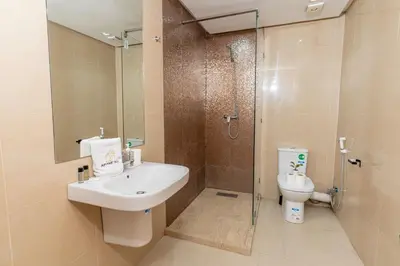 a bathroom with a sink and a shower and a toilet at 7th Floor 3BR with Terrace - AppartAli Luxury Platform in Casablanca