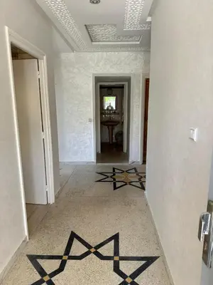 a hallway with a black x on the floor at Villa à Harhoura in Temara
