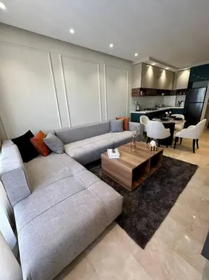 a living room with a couch and a table at Studio Eucalyptus CFC n 16 in Casablanca