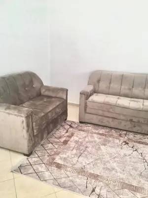 two couches and a couch in a living room at Mohammed V Airport Appartement in Deroua