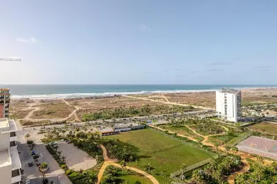 an aerial view of the beach and the ocean at Studio Élégant avec piscine à Zenata Eco city in Aïn Harrouda