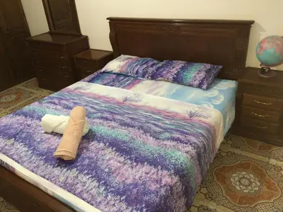 a stuffed animal is laying on a bed at Appartement à louer UNIQUEMENT pour famille et couple marié in Mohammedia