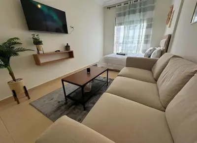 a living room with a couch and a table at très joli appartement vue sur mer présentation acte de mariage si couple in Rabat