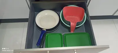 a box with utensils sitting on a shelf at Cosy Appartement piscine view Magic house Mansouria in Mansouria