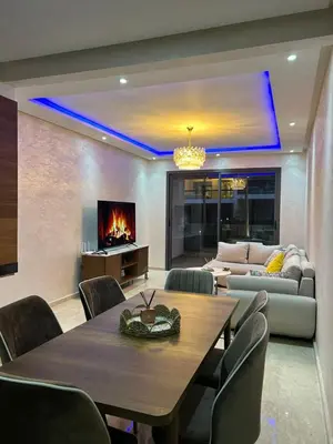 a living room with a table and a couch at Dar Bouazza getaway in Tamaris