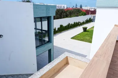 a view from the balcony of a house with a window at Villa Luxe Dar Bouazza - Piscine Privée - Fibre 100Mb - 3 min Plage in Casablanca