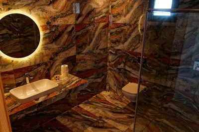 a bathroom with a sink and a glass shower at Villa Luxe Dar Bouazza - Piscine Privée - Fibre 100Mb - 3 min Plage in Casablanca
