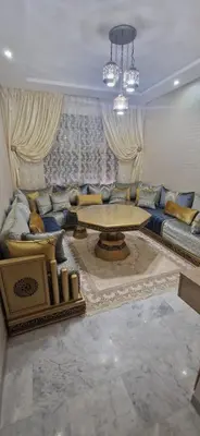 a living room with a couch and a table at Cozy Guesthouse, Ain Sebaa, Casablanca in Casablanca