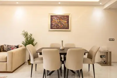 a dining room with a table and chairs at Joli appartement 2 chambres in Casablanca