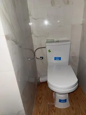 a bathroom with a white toilet in a room at chic chambre meublée in Casablanca
