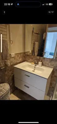 a bathroom with a white sink and a mirror at Bouznika, Shems Kettani in Bouznika