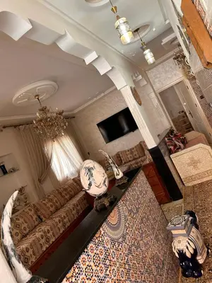 an overhead view of a living room with a couch at Maison wafaa in O Ben Slimane