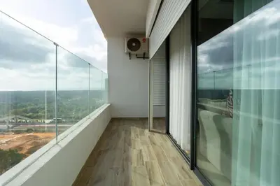 a balcony with a view of a building at Appartement Royal in Beni Brour