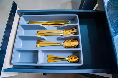 a plastic container filled with forks and spoons and forks and knives at R102- Stylish and Functional 1 BR Apartment at the center of Belvedere in Casablanca
