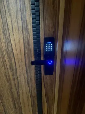 a blue light on a door with a door knob at Appartement de prestige à Casablanca in Casablanca
