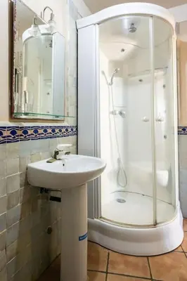 a bathroom with a sink and a shower at Résidence beach house in Dar Bouazza