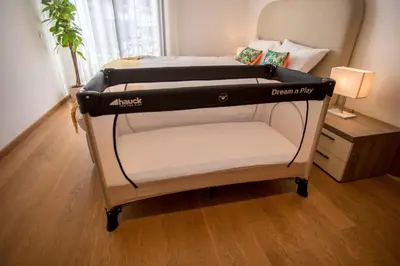 a bed with a black and white bed frame in a room at Haut Standing 2-Bedroom Apartment in Gauthier in Casablanca
