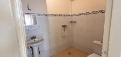 a bathroom with a sink and a toilet at Residence Louma in Mohammedia