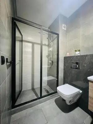 a bathroom with a shower and a toilet in it at Appartement Dahlia - Haut Standing - Mohammedia Natura Living in Mohammedia