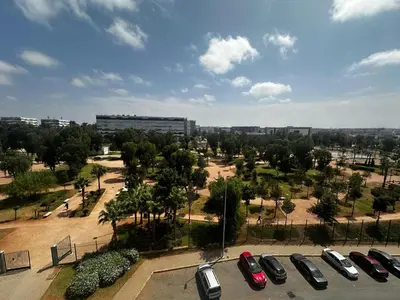 a parking lot with cars parked in a park at Apartment à 1 min de Casanearshore in Casablanca