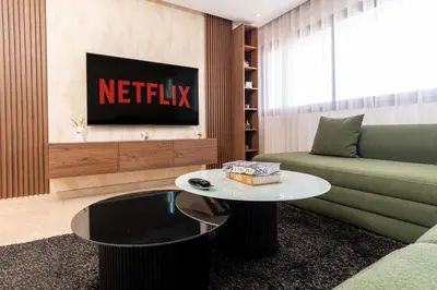 a living room with a couch and a table at Casa Streets 3 BR Terrace - AppartAli Luxury Platform in Casablanca