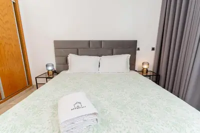 a bedroom with a bed with two towels on it at Penthouse View 2BR Terrace - AppartAli Luxury Platform in Casablanca
