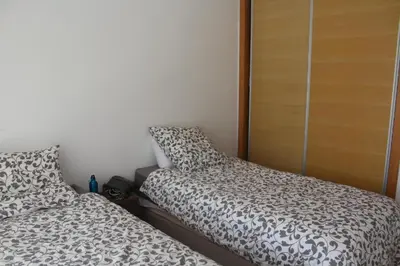 two beds sitting next to each other in a bedroom at Paradise 7 in Pont Blondin