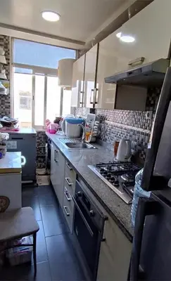 a kitchen with a stove and a counter top at الشقة دار بوعزة in Dar Bouazza