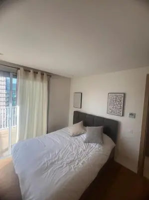 a bed with two pillows on it in a bedroom at Beautiful Casablanca finance city Apartment in Casablanca