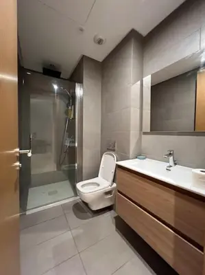 a bathroom with a toilet and a shower and a sink at Beautiful Casablanca finance city Apartment in Casablanca