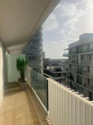 an apartment balcony with a view of a building at Beautiful Casablanca finance city Apartment in Casablanca