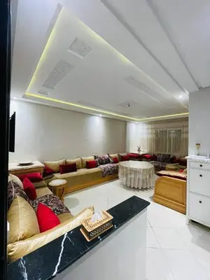a large living room with couches and a table at appartement sublime in Oulad Hamida