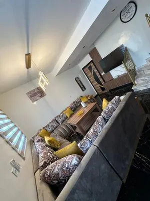 an overhead view of a living room with a couch at Appartement Casablanca proche de la mer in Dar Mouddene