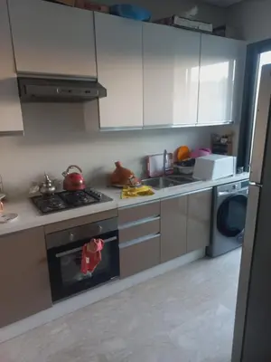 a kitchen with a stove and a stove top oven at Résidence la vallée de Californie ahfad in Le Polo