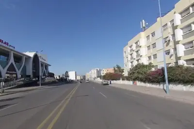 an empty street in front of a building at Magnifique Studio Gare - Tram in Les Camps