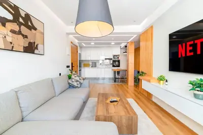 a living room with a couch and a table at Modern and Luxurious apartment in Rabat