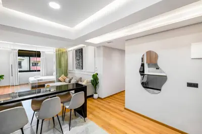 a kitchen and living room with a table and chairs at Modern Elegance in City Core in Gare de Rabat-Aguedal