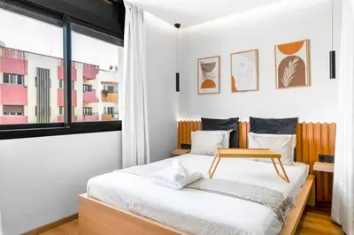 a bedroom with a bed and a window at Modern Elegance in City Core in Gare de Rabat-Aguedal